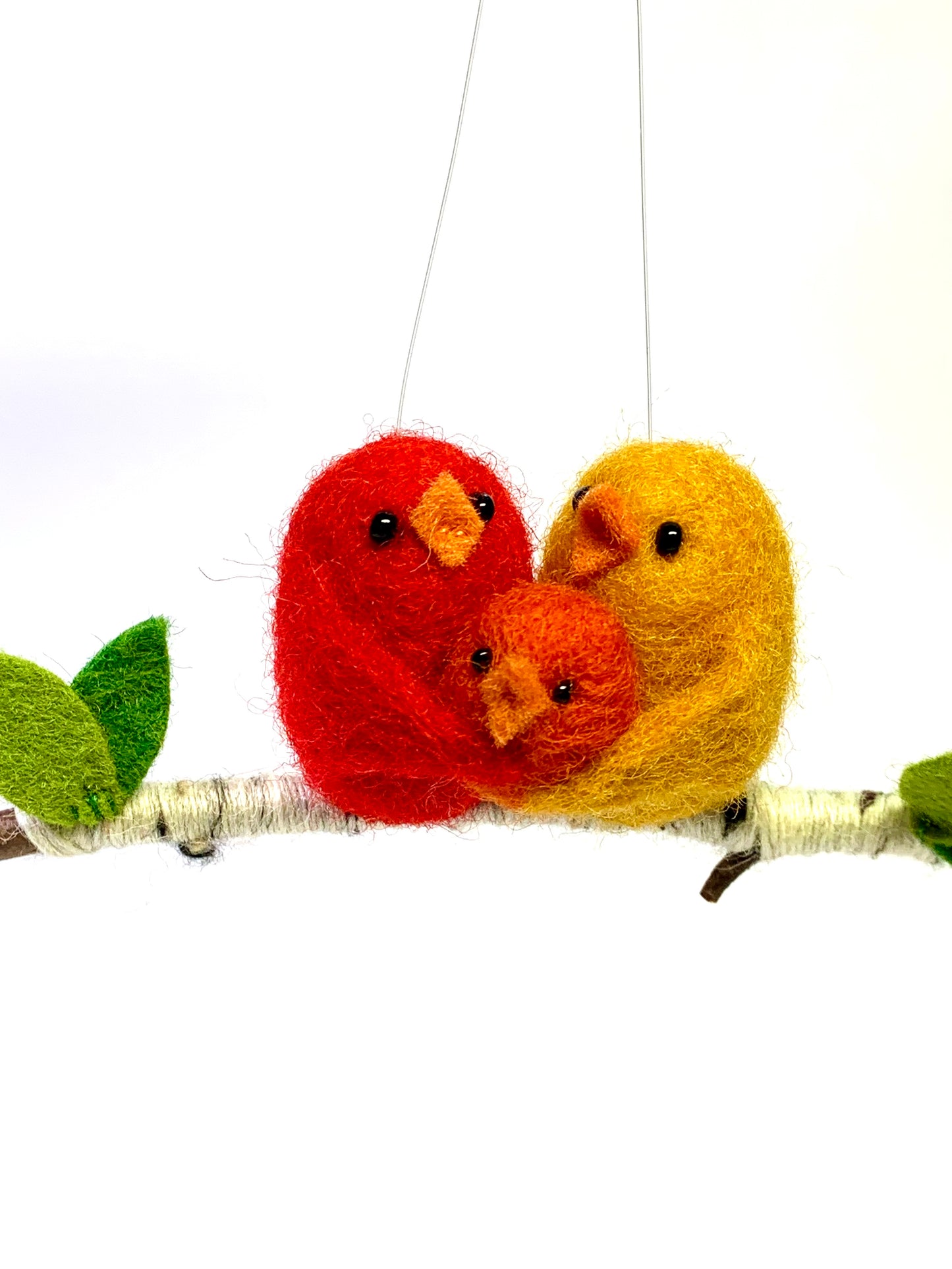 needle-felted red, yellow, and orange bird ornament