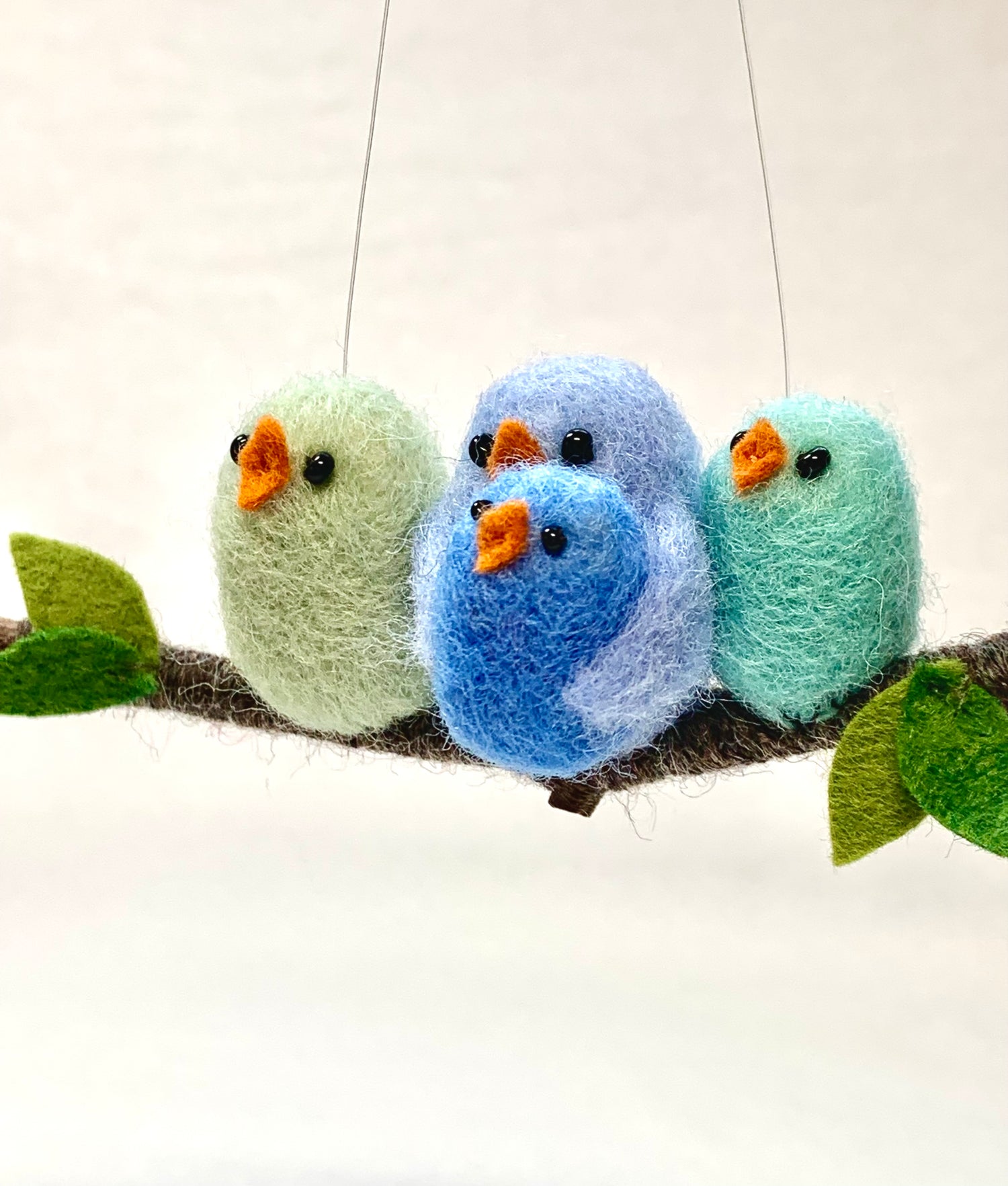 wool bird family perched on a twig ornament
